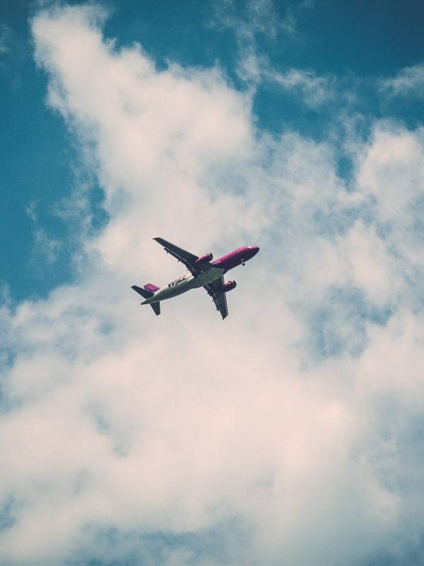 low-angle-view-airplane-flying-sky